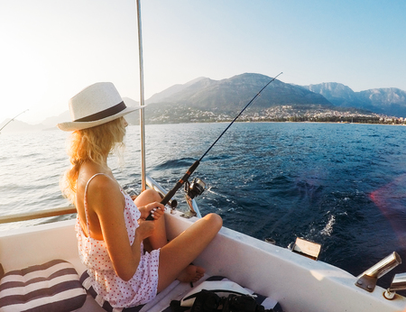 Attractive girl on a yacht at summer dayの写真素材