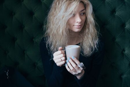 woman holding a coffee mugの写真素材