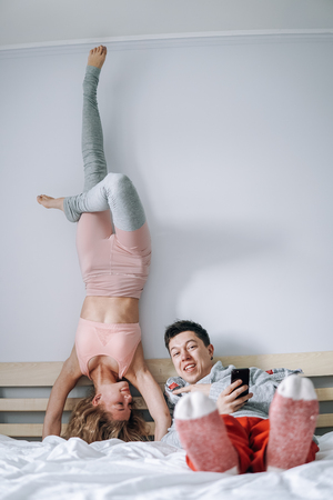 man and woman on the bedの写真素材