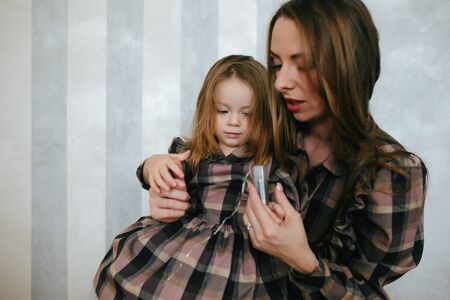 Young mother with adorable babyの写真素材