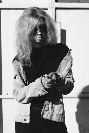 beautiful girl hipster against the wallの写真素材