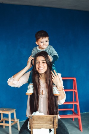 Mother and young son posing at honeの写真素材