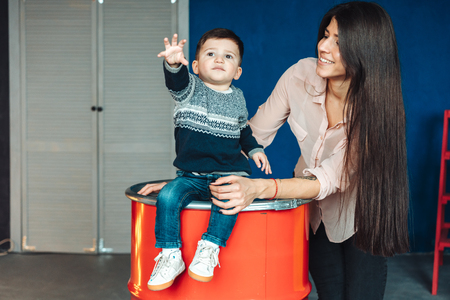 Mother and young son posing at honeの写真素材