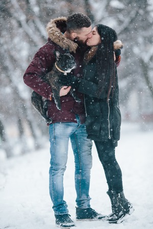 Beautiful young couple kissingの写真素材
