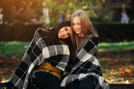 two beautiful in the park, posing for the cameraの写真素材