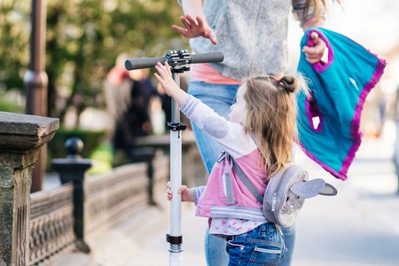 Little girl and scooterの写真素材