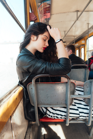 Woman traveling inside the tramの写真素材