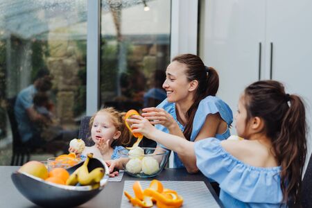 Mom and daughter in the kitchenの写真素材