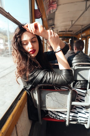 Woman traveling inside the tramの写真素材