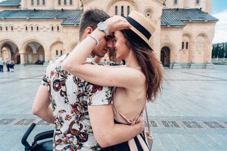Young couple in love, hugging on the street.の写真素材