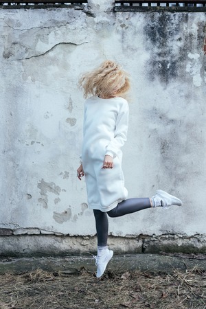 The blonde in the alleyの写真素材