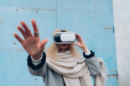Girl in the street with a vr glassesの写真素材