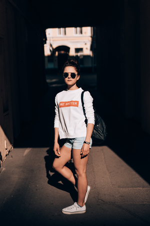 Young girl on the city streetの写真素材