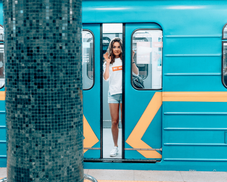Beautiful young girl posing on metro stationの写真素材