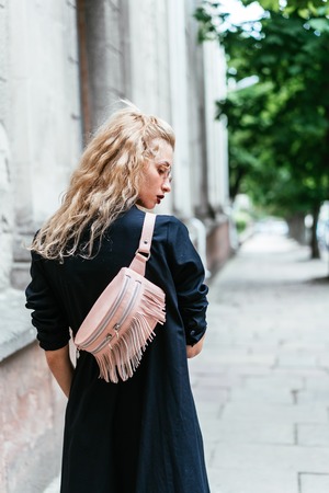 Blonde woman with a bagの写真素材