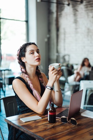Young woman sitting in coffee shop