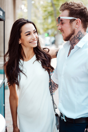 Girl and handsome guy outdoorsの写真素材