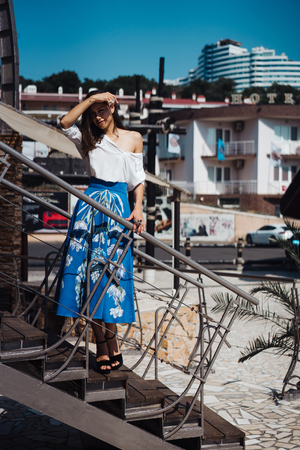 Young pretty woman on the pier nearの写真素材