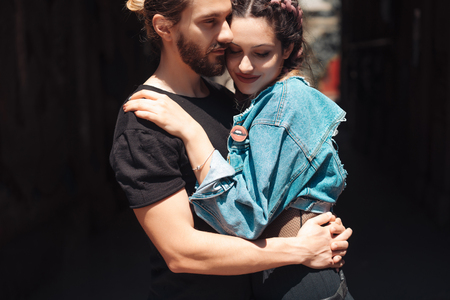 Young man and woman on the streeの写真素材