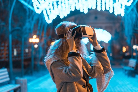 Young girl getting experience VR headset