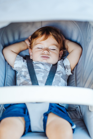 Little baby sleeping in a stroller.