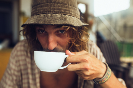 bearded guy drinking coffeeの写真素材