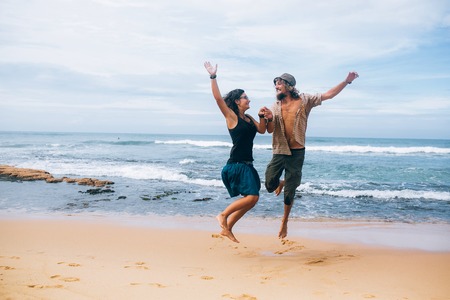 guy and girl have fun on the beachの写真素材