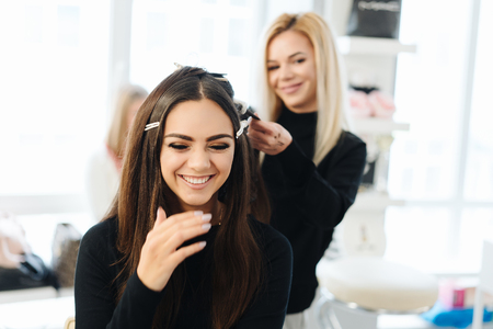 Makeup and hairstyle for a beautiful modelの写真素材