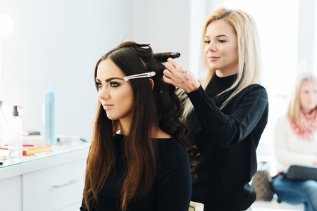 Makeup and hairstyle for a beautiful model