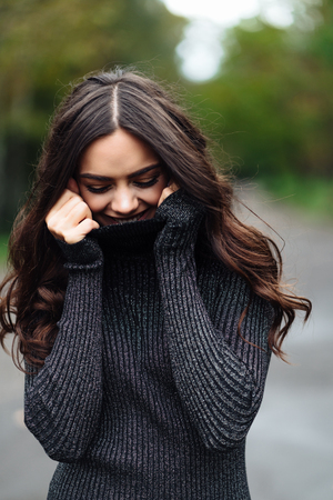 Outdoor portrait of young pretty beautiful calm womanの写真素材