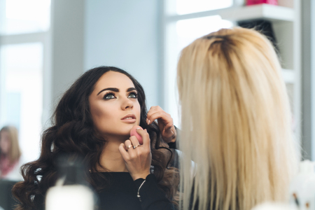 Makeup and hairstyle for a beautiful modelの写真素材