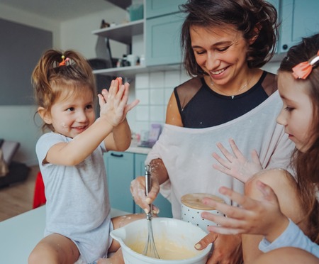Happy family cook together in the kitchenの写真素材