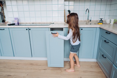 little girl opens the closetの写真素材