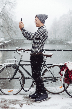 Guy is standing on a bridgeの写真素材