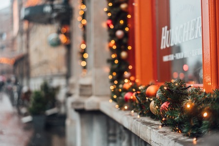 Christmas winter decorations on the window from the outsideの写真素材