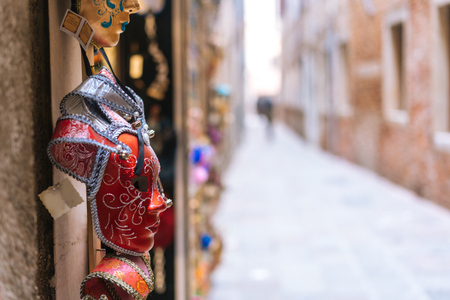 Traditional venetian mask in store on streetの写真素材