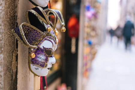 Traditional venetian mask in store on streetの写真素材