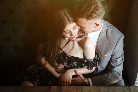 Young couple posing at the camera