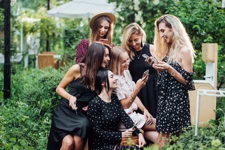 Six girls with mobile phones