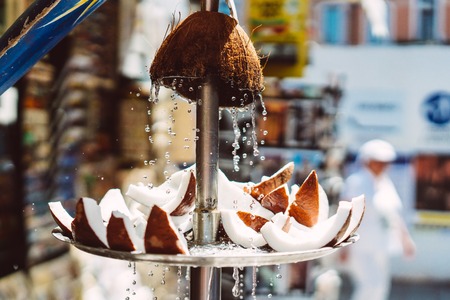 pieces of fresh coconut lie on a plateの写真素材