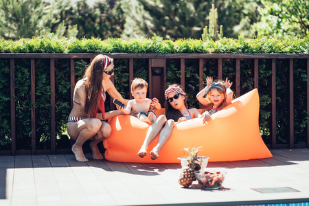 Beautiful mother with two daughters and littel son.の写真素材