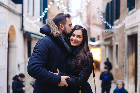 Guy and attractive girl are standing together on street.の写真素材