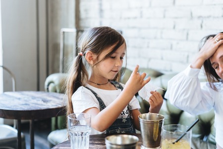 Little girl holding a check in her handsの写真素材