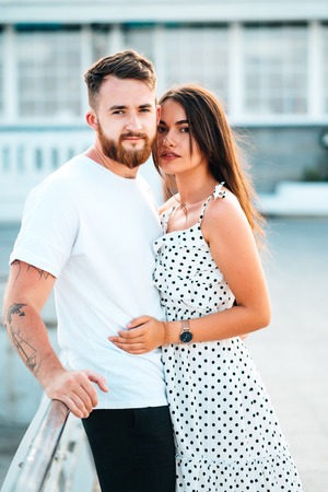 Handsome bearded man hugging his beautiful girlの写真素材