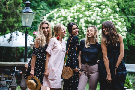 Five girls posing on cameraの写真素材