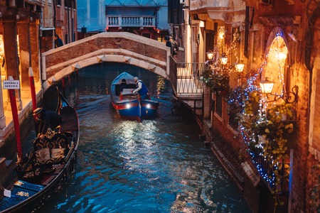 Venice canal late at night with street light illuminatingの写真素材