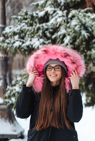 Young beautiful woman at winter cityの写真素材