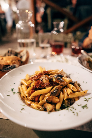 Pasta seashells with minced meat on the tableの写真素材
