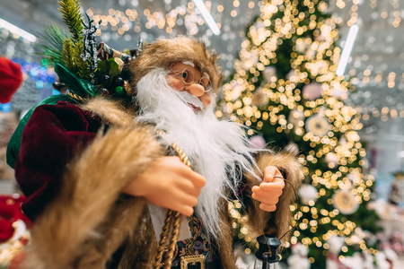 Happy Santa on background of bokeh christmas tree.の写真素材