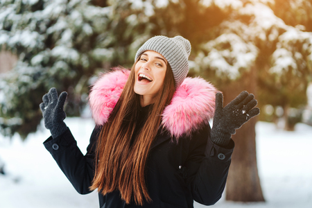 Young beautiful woman at winter cityの写真素材